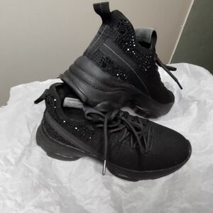 Madden girl black switch sparkle embellishments on the back.  7 1/2